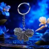 Silver butterfly-shaped keychain with blue evil eye bead decoration, fashionable and personalized pendant gift Specification image